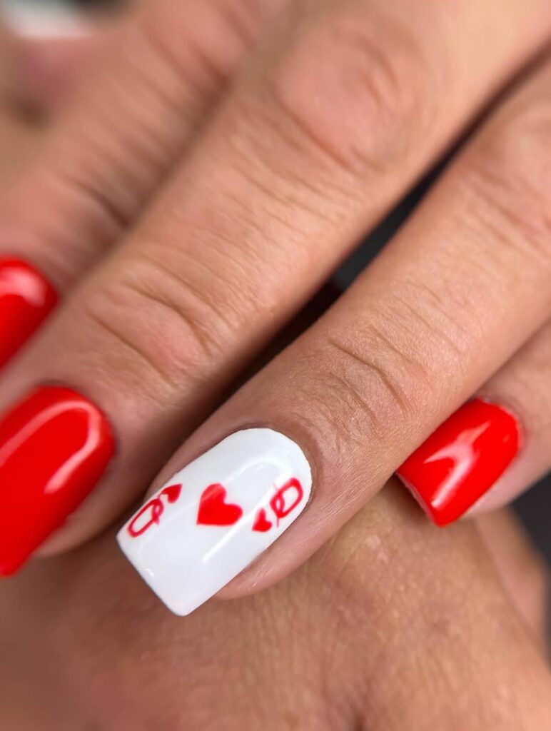 White Nails with Doodles and Red Tips