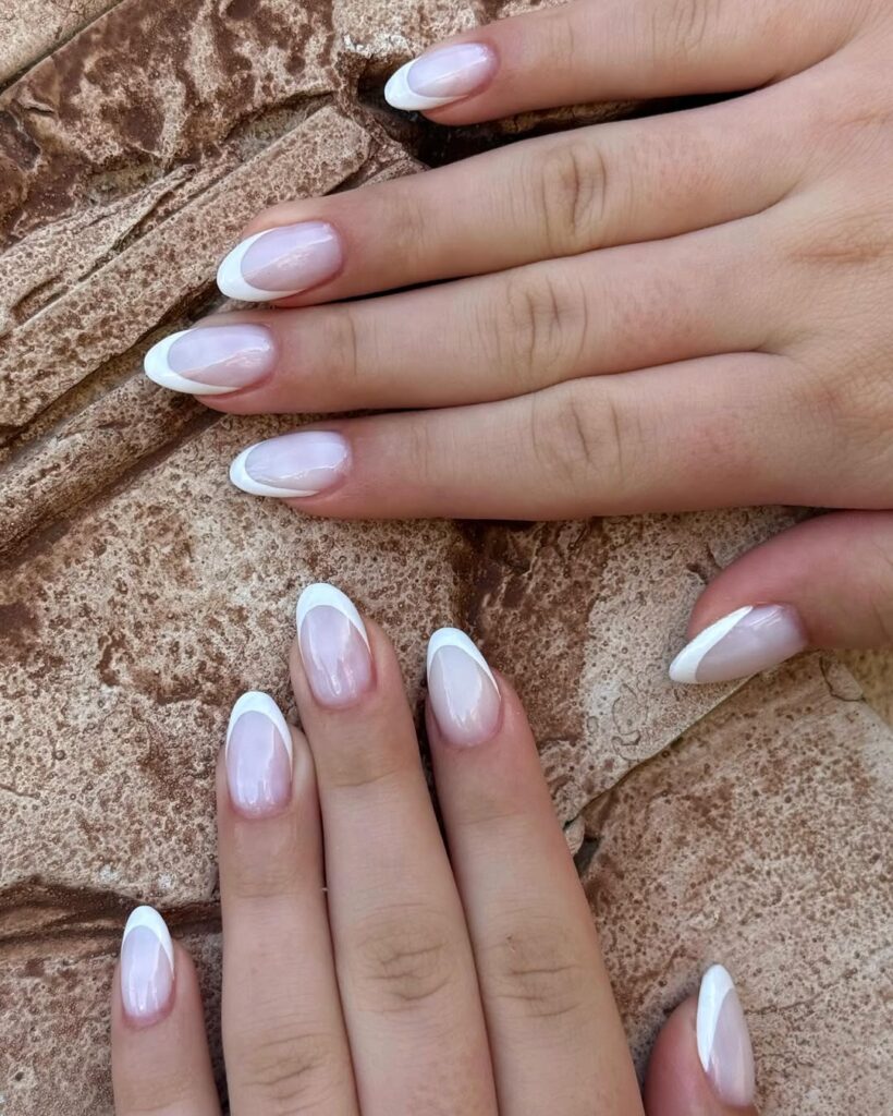 Hailey Bieber nails - glossy French twist manicure with clean, minimalist elegance