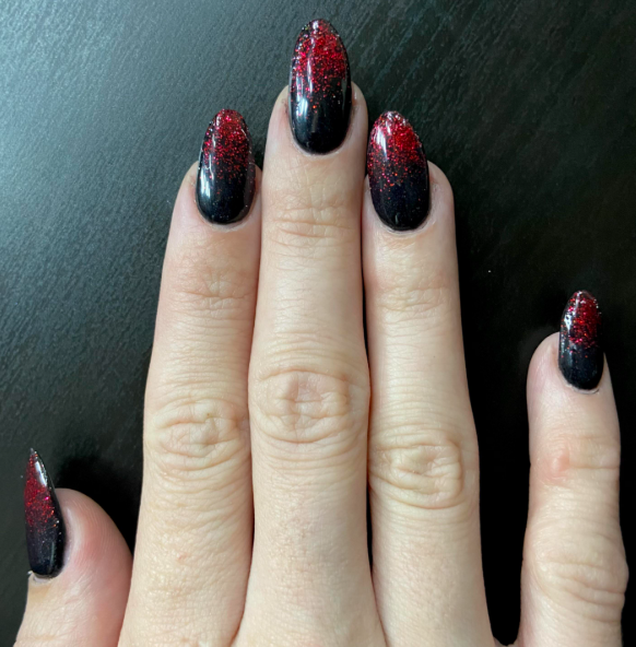 Dark red and black ombre nails blending seamlessly for a dramatic, edgy look.