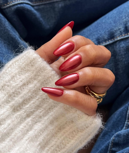 Dark red chrome nails with a high-shine, metallic finish for a bold and futuristic look.